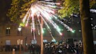 Fireworks explode over riot police officers on the Champs-Elysees avenue after the Champions League final soccer match between Paris Saint-Germain and Inter Milan.