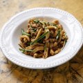 East meets West in a bowl of casarecce with Lao sausage, snake beans and garlic chives.