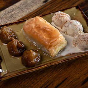 Greek desserts include baked figs in cognac served with halva ice-cream.