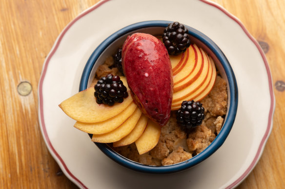 Fruit baked under a crunchy topping, served with a scoop of deep purple berry sorbet. 