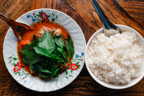 Red curry of barbecue duck with snake bean and sweet basil.