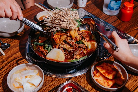 Split a bowl of gamjatang soup with friends at Guk’s Eedaero Gamjatang.