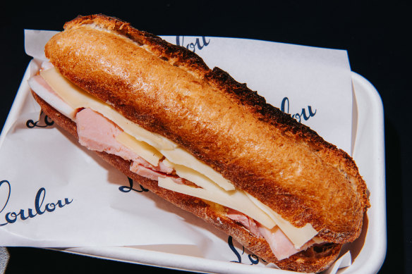 Loulou’s baguette has triangles of sliced gruyère on both sides of the roll, a sensible thickness of thinly sliced ham and lots of house-made butter. 