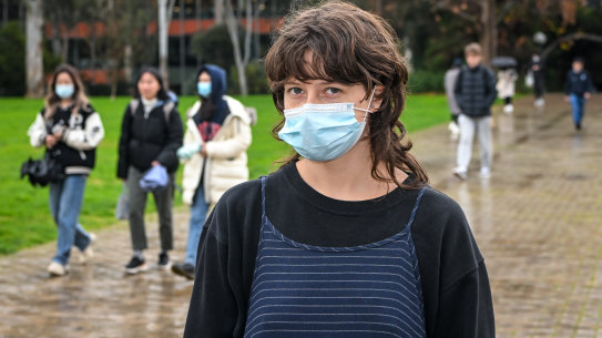 First-year arts student Georgia Gillies supports Melbourne University’s directive to mask up in classrooms, but questions why it has dropped its vaccination mandate.