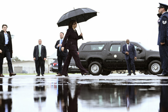 Vice President Kamala Harris boards Air Force Two as she departs from Ellington Airport in Houston.