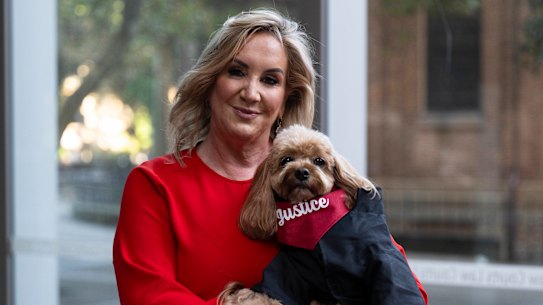 Gina Edwards and Oscar the cavoodle after she won her defamation case against Nine.