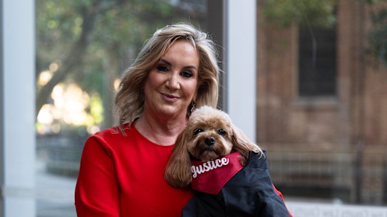 Gina Edwards and Oscar the cavoodle after she won her defamation case against Nine.