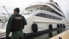 A Spanish civil guard stands by the yacht called Tango in Palma de Mallorca after its seizure.