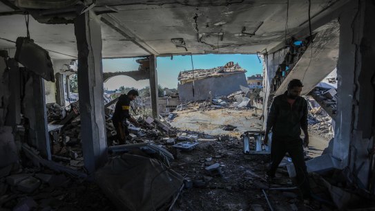 Residents of Gaza in a home in Khan Yunis that was hit by Israeli airstrikes prior to the temporary ceasefire.