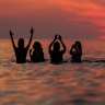 Students from St Andrews University take part in the traditional May Day dip into the North Sea at East Sands beach in St Andrews, Scotland. The May Day Dip is traditionally held to bring students good luck during exams.