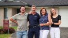 Aidan Saarman, Tony Saarman, Pauline Saarman and Taryn Saarman outside their home.