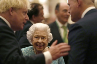 Not feeling old: Queen Elizabeth II seen speaking with Prime Minister, Boris Johnson and a guest during a reception for international business and investment leaders at Windsor Castle.