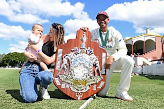 Usman Khawaja celebrates winning the 2021 Sheffield Shield with his wife Rachel and daughter Aisha. 
