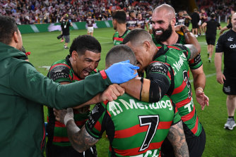 Yeah, baby ... Cody Walker, Dane Gagai and Mark Nicholls celebrate with Adam Reynolds.