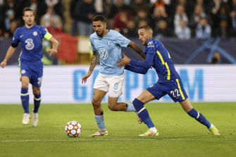 Sergio Pena, centre left, battles for the ball with Hakim Ziyech.