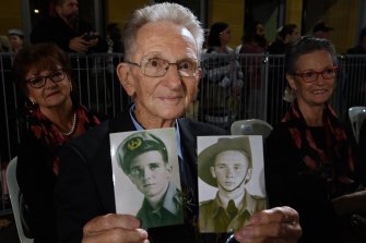 Len McLeod with photos of himself in the Australian and US armies.