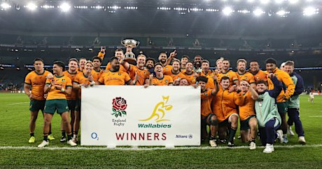 The Wallabies celebrate with the Ella Mobbs Cup after their victory.
