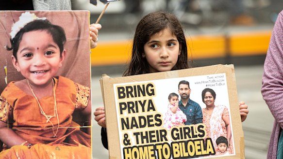 A young girl takes part in a rally supporting the family in Melbourne on Sunday 