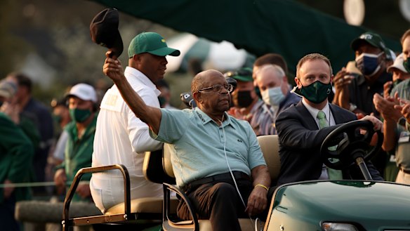 Lee Elder waves to fans at the Masters at Augusta this year.