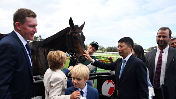 Yuesheng Zhang (second from right) with Treasurethe Moment and trainer Matt Laurie (left) after the group 1 Vinery Stud Stakes in Sydney.