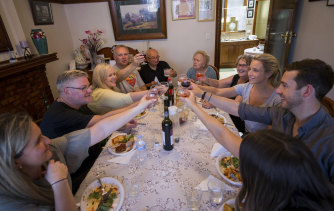 Nonna Lucia Salvati, right rear, and family have lunch after their hard work.
