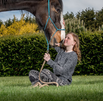 Young survivors of trauma like Shamanii, 13, will do equine therapy with horses like Humphrey on a farm near Creswick. 
