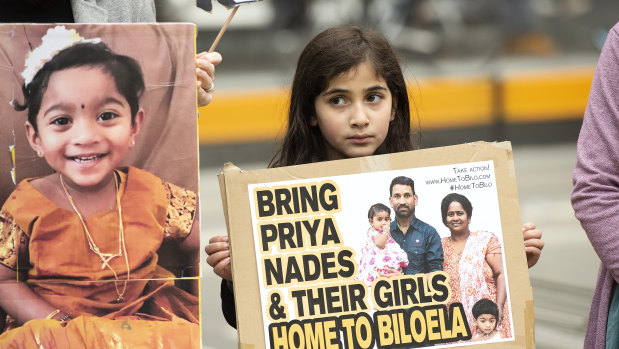 A young girl takes part in a rally supporting the family in Melbourne on Sunday 