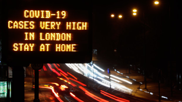 A sign near a highway in London urged people to stay at home.