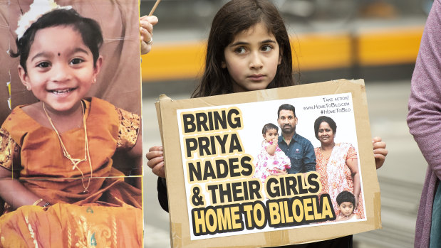 A young girl takes part in a rally in Melbourne supporting the Tamil family seeking asylum on Sunday.