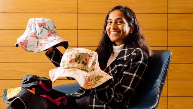 UQ graduate Famin Ahmed works for MinterEllison and has a side hustle making hats for charity.