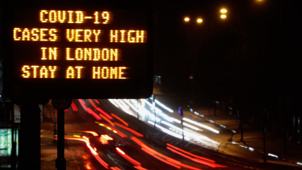 A sign near a highway in London urged people to stay at home.