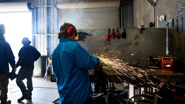 BackTrack worker Matty Symington teaching teenagers welding skills.