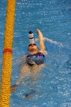 Training for the Sydney Olympics, backstroker Clementine Stoney, used a drink bottle to fine tune her balance in the Olympic Pool.