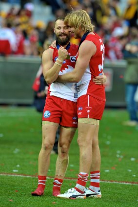 Lewis Roberts-Thomson embraces Nick Malceski after achieving the ultimate success.