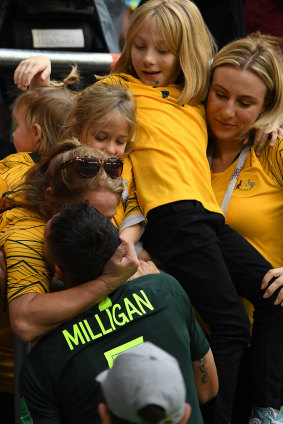 Entourage: Mark Milligan embraces his family after the draw against Denmark at Samara Arena.