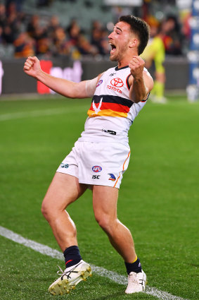 Jubilation: Lachlan Murphy kicks a goal for the Crows.