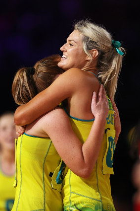 Greta Bueta and Steph Wood share a hug after their win over England.