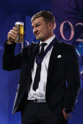 Port Adelaide’s Ollie Wines toasts his victory.