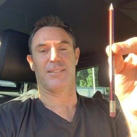 Brad Fittler ‘pencils in’ his NSW Blues team for Origin 1 from his car.