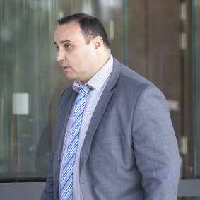 Detective Senior Constable Andrew Agostino leaves the Coroners Court on Monday.