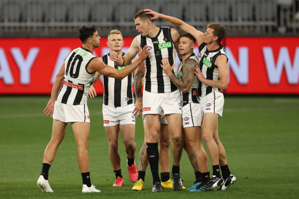 Mason Cox celebrates a goal with teammates.