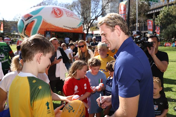 Max Jorgensen with kids at the Rugby World Cup fan site at Circular Quay.