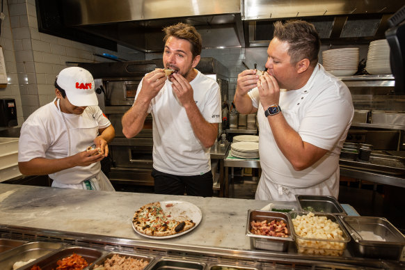 Stan Wawrinka (centre) with Juan Carlos (left) and executive chef Damian Snell (right) in the kitchen.