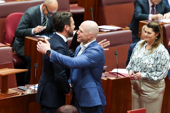 Senator Jonno Duniam is embraced by Senator David Pocock.