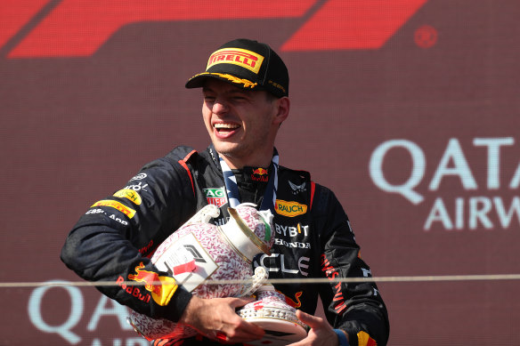 Race winner Max Verstappen of the Netherlands celebrates on the podium. 