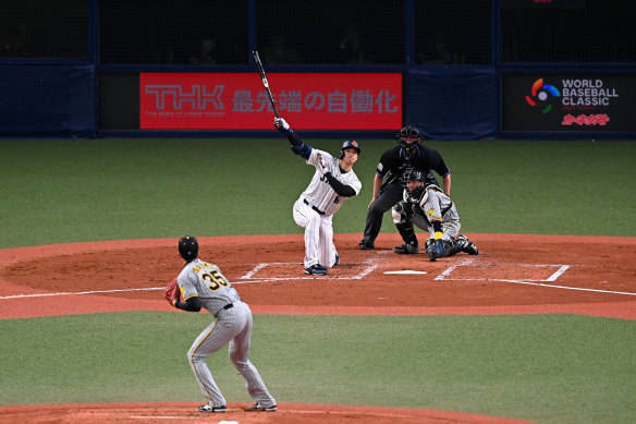 Down on one knee, Shohei Ohtani smacked a home run over centre field in a warm-up match for Japan before the World Baseball Classic.