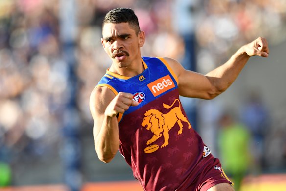 Charlie Cameron of the Lions celebrates one of his five goals against the Cats.