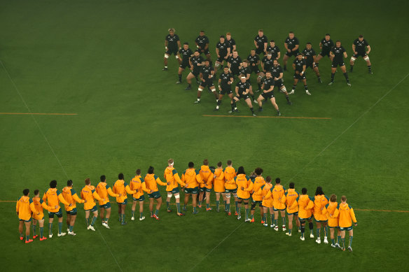 The All Blacks perform the haka in front of the Wallabies.