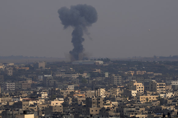 Smoke rises after Israeli air strikes on a residential building in Gaza on Saturday.
