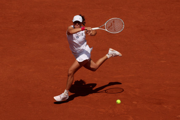 World No.1 Iga Swiatek im full flight against Coco Gauff.